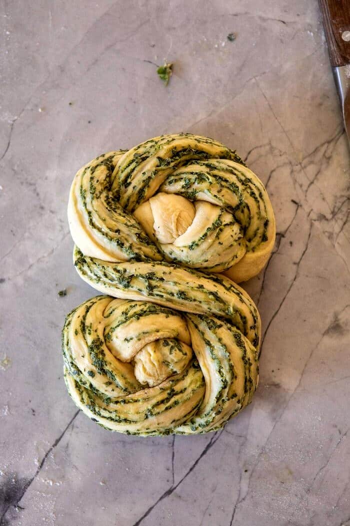 Swirled Garlic Herb Bread | halfbakedharvest.com #garlicbread #herbbread #homemadebread Swirled Garlic Herb Bread on counter before baking
