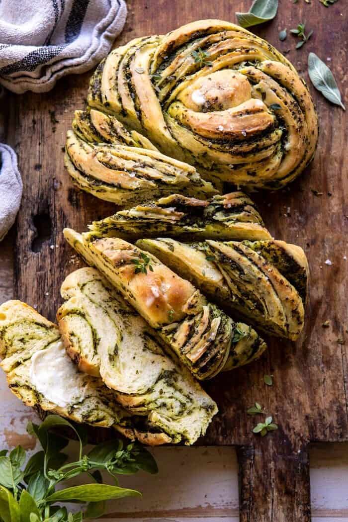 Swirled Garlic Herb Bread | halfbakedharvest.com #garlicbread #herbbread #homemadebread overhead photo of Swirled Garlic Herb Bread with multiple slices cut