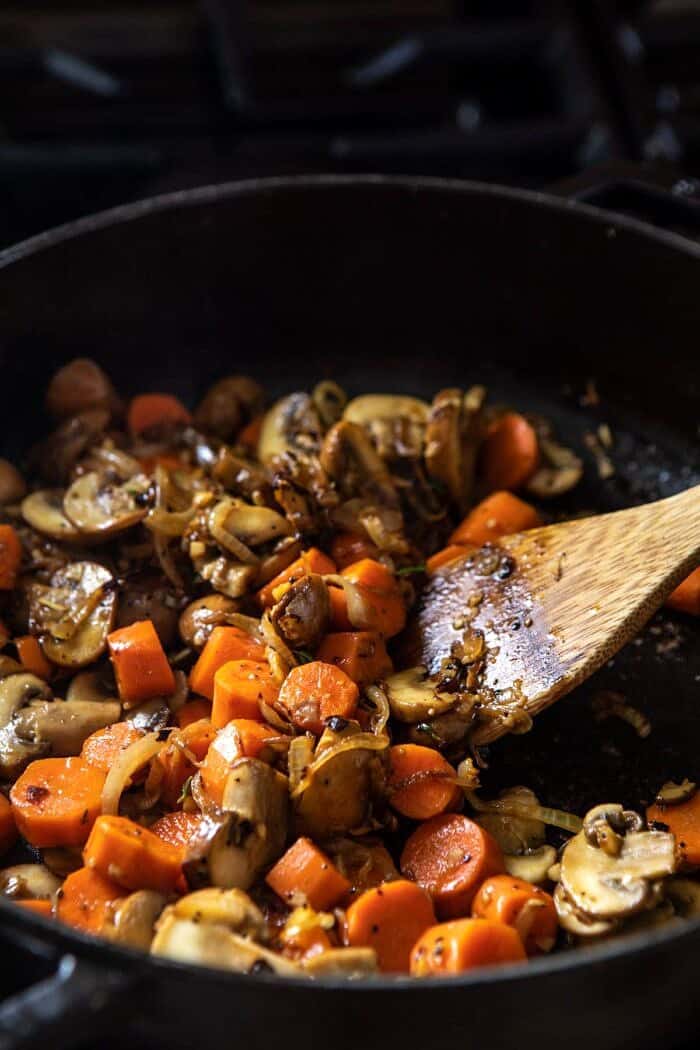 side angled photo vegetables cooking in skillet
