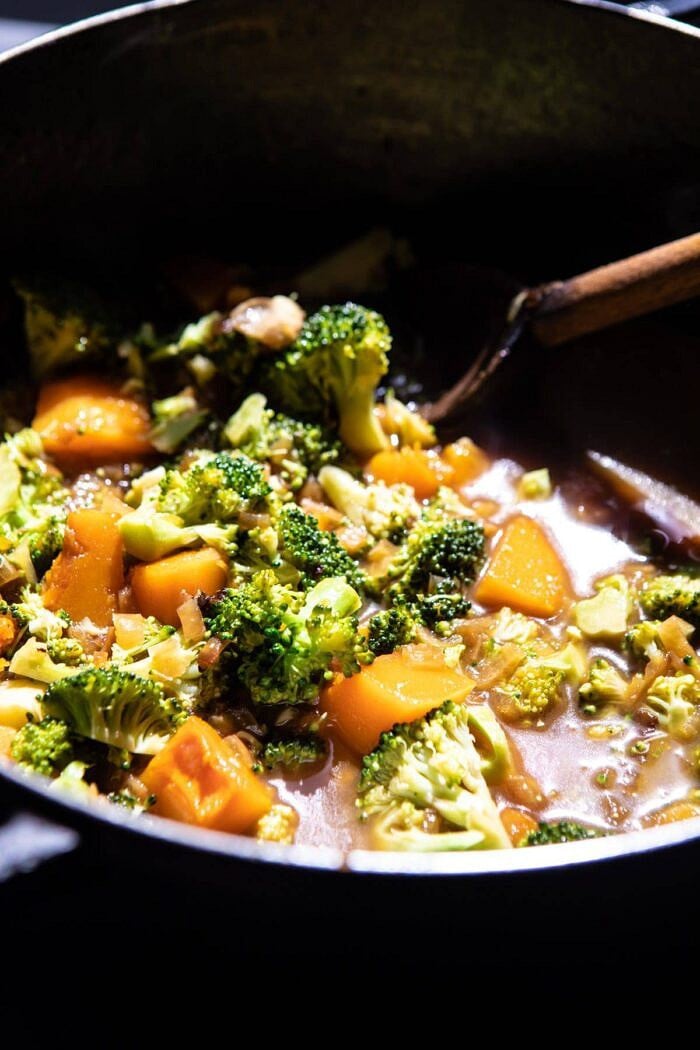 side angled photo of Creamy Broccoli and Butternut Squash Soup in soup pot before pureeing 