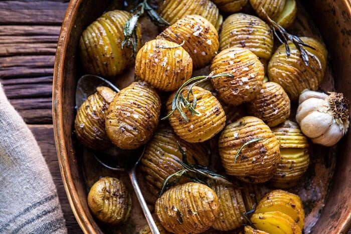 Crispy Rosemary Butter Roasted Potatoes | halfbakedharvest.com #potatoes #fall #autumn #Thanksgiving #Christmas horizontal photo of Crispy Rosemary Butter Roasted Potatoes