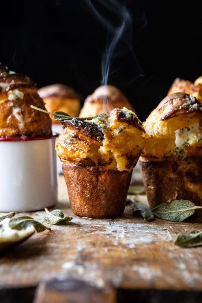 Parmesan Popovers with Crispy Sage Garlic Butter | halfbakedharvest.com #popovers #bread #easyrecipes Parmesan Popovers with Crispy Sage Garlic Butter with steam coming out