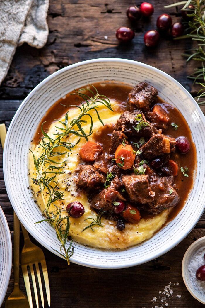 Cranberry Cider Braised Beef Stew with Rosemary Polenta | halfbakedharvest.com #slowcooker #instantpot #beef #polenta overhead close up photo of Cranberry Cider Braised Beef Stew with Rosemary Polenta