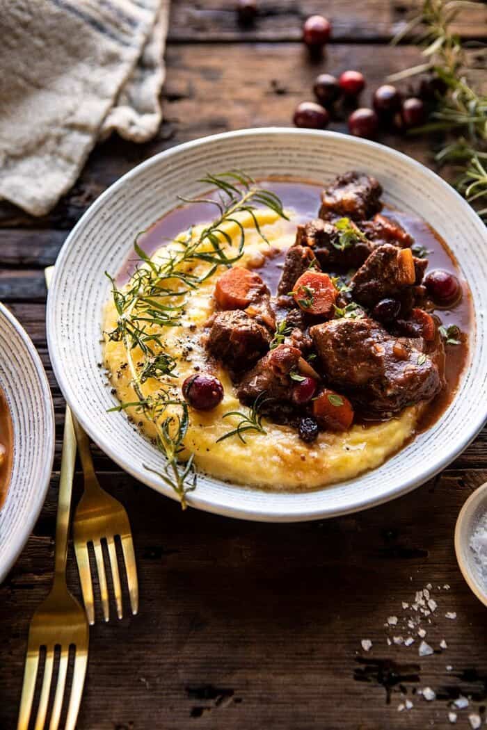 Cranberry Cider Braised Beef Stew with Rosemary Polenta | halfbakedharvest.com #slowcooker #instantpot #beef #polenta side angled photo of Cranberry Cider Braised Beef Stew with Rosemary Polenta