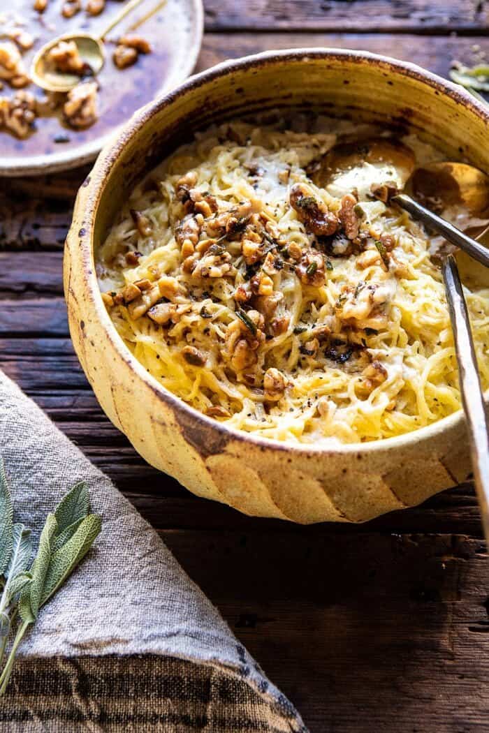 Creamed Spaghetti Squash with Browned Butter Walnuts | halfbakedharvest.com #spaghettisquash #healthy #thanksgiving #sage side angled photo of Creamed Spaghetti Squash with Browned Butter Walnuts