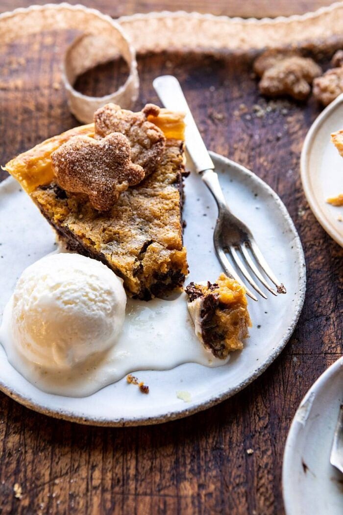 overhead photo of Gooey Chocolate Chip Cookie Pumpkin Pie slice with ice cream on plate