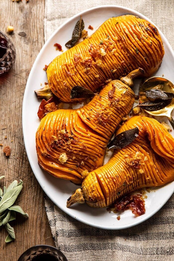 Hasselback Butternut Squash with Sage Butter and Prosciutto Breadcrumbs | halfbakedharvest.com #thanksgiving #sidedishes #butternutsquash overhead photo of Hasselback Butternut Squash with Sage Butter and Prosciutto Breadcrumbs