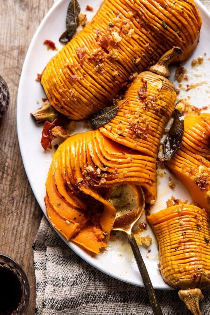 Hasselback Butternut Squash with Sage Butter and Prosciutto Breadcrumbs | halfbakedharvest.com #thanksgiving #sidedishes #butternutsquash overhead photo of Hasselback Butternut Squash with Sage Butter and Prosciutto Breadcrumbs
