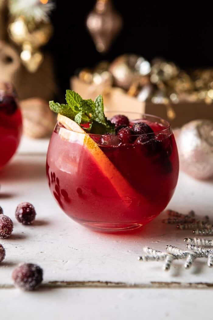 Jingle Bell Cranberry Paloma | halfbakedharvest.com #tequila #christmasdrinksaturday #holiday front on close up photo of Jingle Bell Cranberry Paloma
