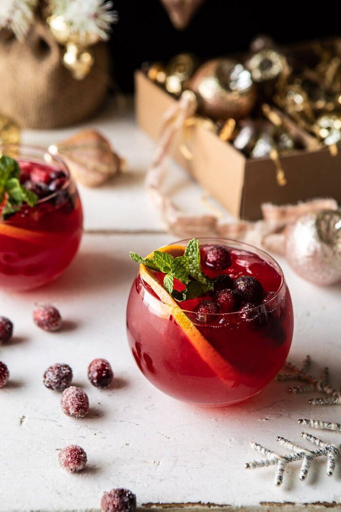 Jingle Bell Cranberry Paloma | halfbakedharvest.com #tequila #christmasdrinksaturday #holiday overhead photo of Jingle Bell Cranberry Paloma