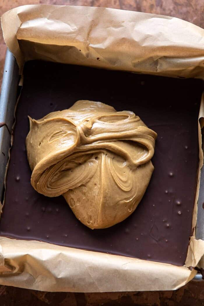 overhead photo of 5 Ingredient Triple Decker Chocolate Peanut Butter Bars before adding the final chocolate layer