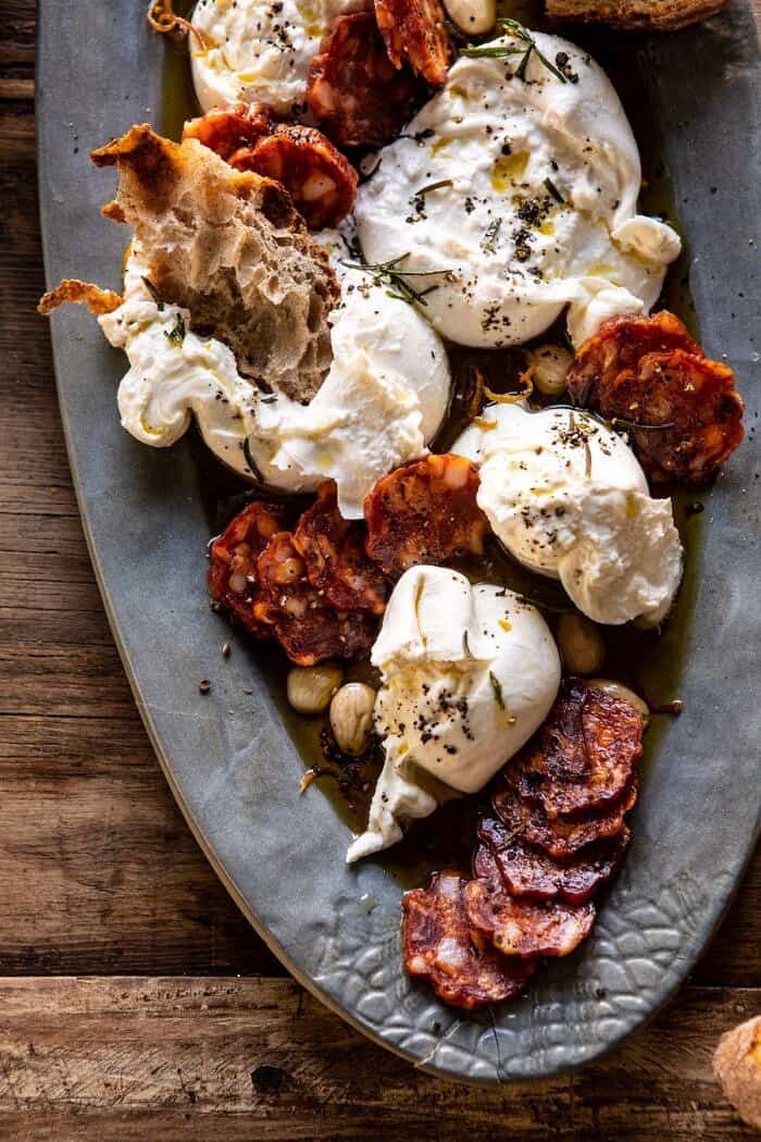 overhead close up photo of Burrata with Lemon Pepper Salami Bites on serving plate