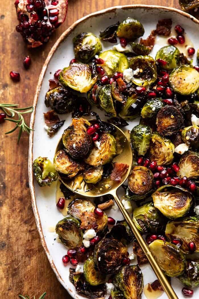 Roasted Bacon Brussels Sprouts with Salted Honey | halfbakedharvest.com #brusselssprouts #healthy overhead close up photo of Roasted Bacon Brussels Sprouts with Salted Honey with spoon on plate