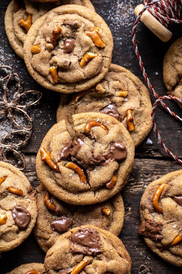 overhead close up photo of Salted Caramel Pretzel Snickerdoodles with 1 cookie broken in half 