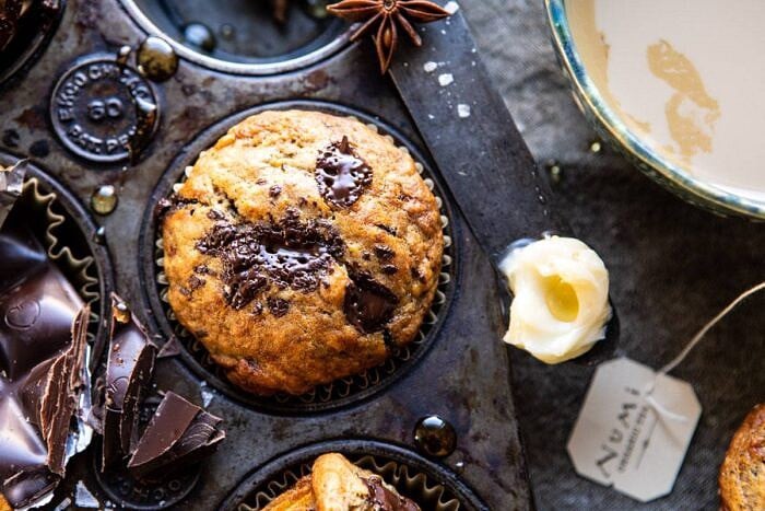 One Bowl Chocolate Chunk Chai Banana Muffins | halfbakedharvest.com #healthy #bananabread #muffin horizontal photo of One Bowl Chocolate Chunk Chai Banana Muffins