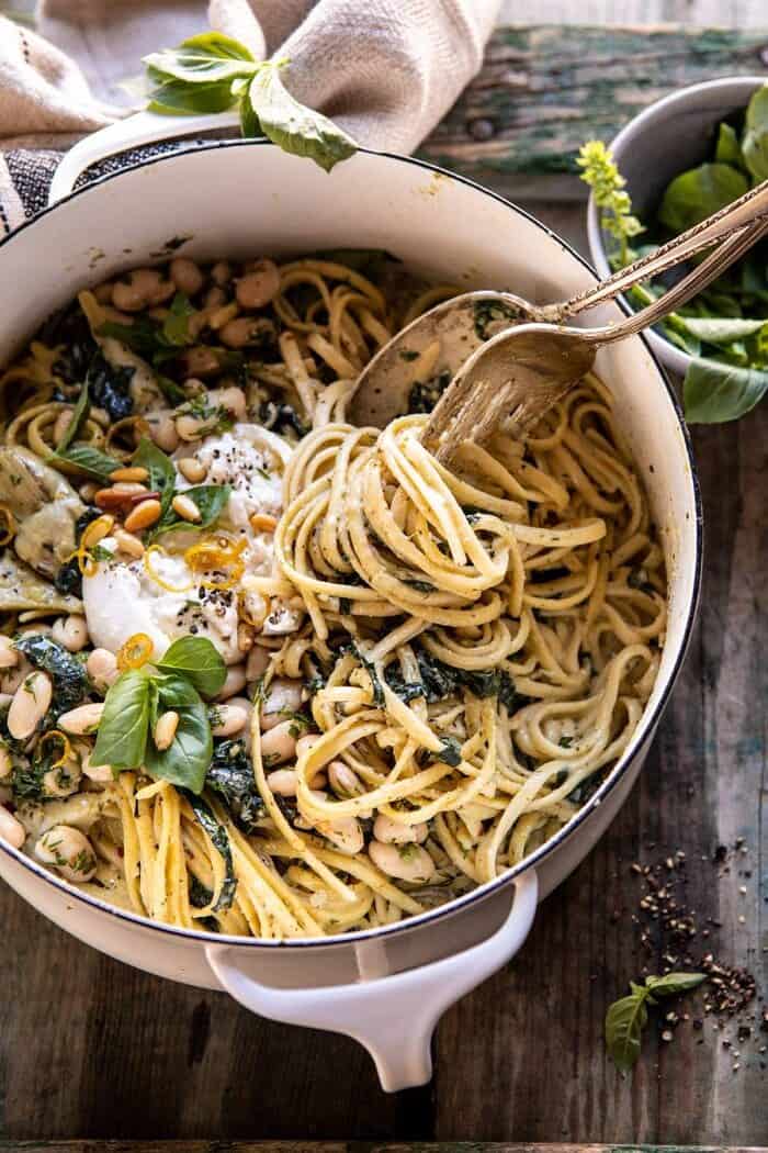 overhead close up photo of One Pot Creamy Tuscan Pesto and Artichoke Pasta 