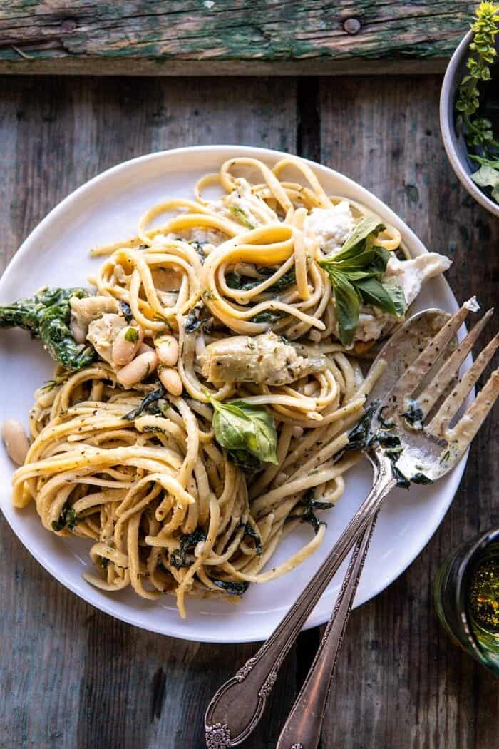 overhead photo of One Pot Creamy Tuscan Pesto and Artichoke Pasta on serving plate