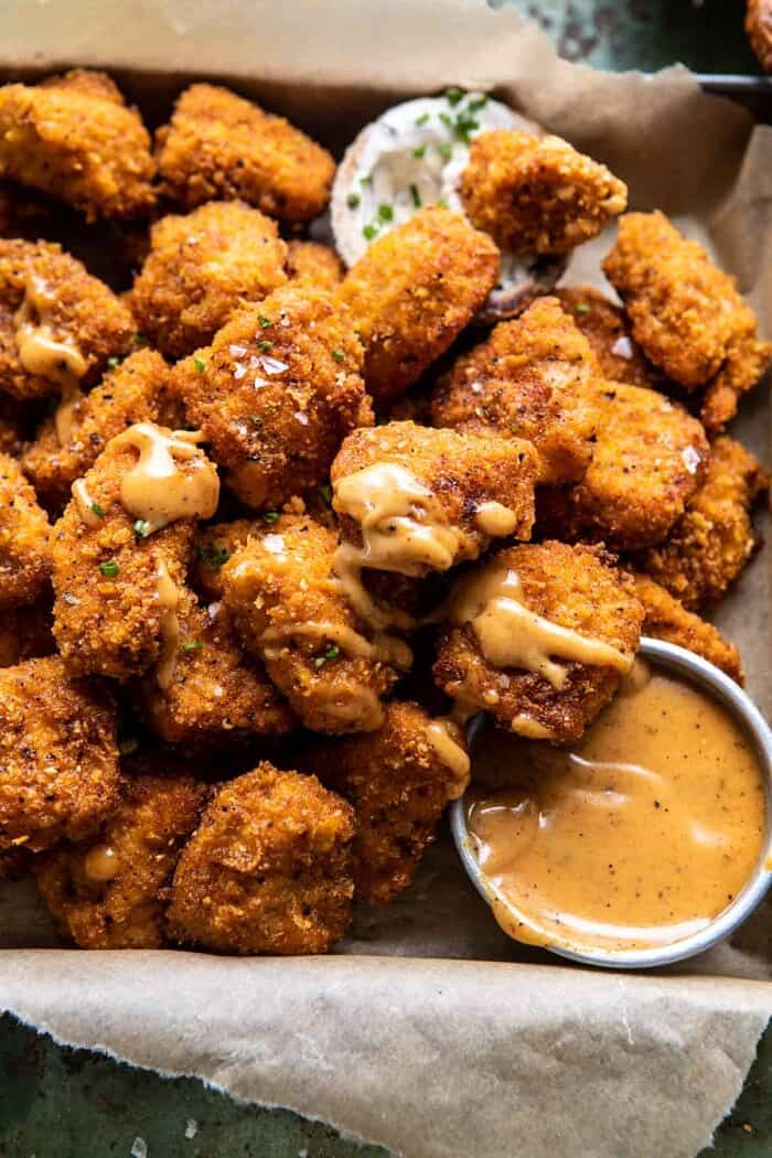 overhead close up photo of Oven Fried Cajun Popcorn Chicken with Creamy Honey Mustard