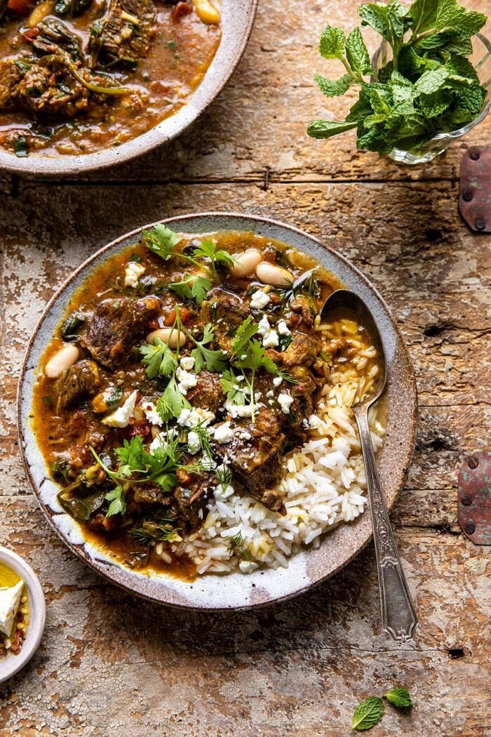 Persian Herb and Beef Stew | halfbakedharvest.com #beefstew #whitebeans #healthy overhead photo of Persian Herb and Beef Stew with spoon in bowl