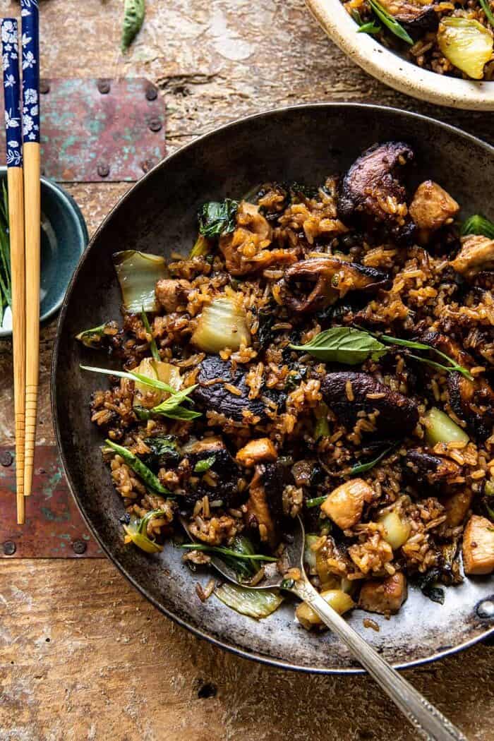 Better Than Takeout Sesame Ginger Chicken Fried Rice | halfbakedharvest.com overhead photo of Better Than Takeout Sesame Ginger Chicken Fried Rice with serving spoon in skillet