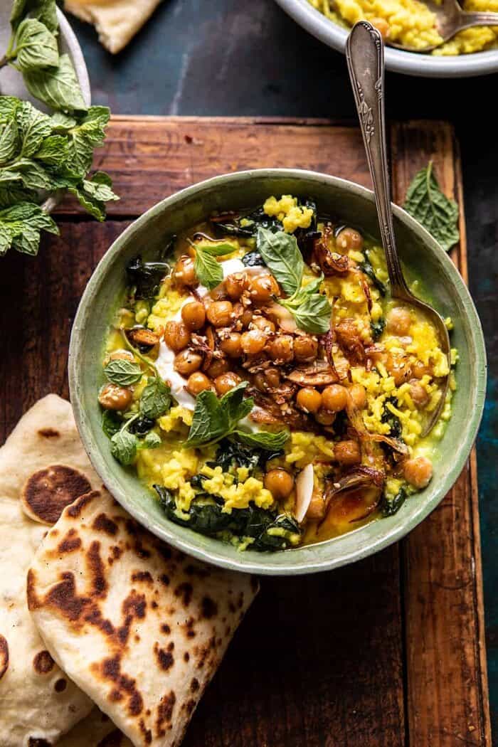 Creamy Golden Rice with Spiced Chickpeas | halfbakedharvest.com overhead photo of Creamy Golden Rice with Spiced Chickpeas with spoon in bowl