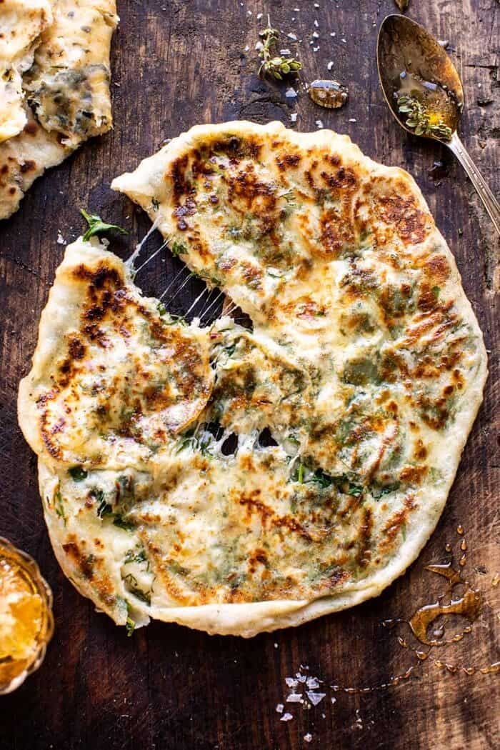 Cheesy Herb Stuffed Naan | halfbakedharvest.com overhead photo of Cheesy Herb Stuffed Naan