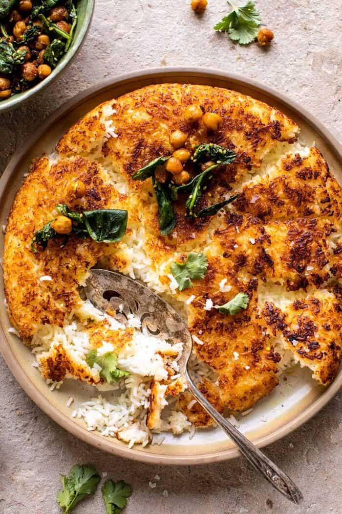 Crispy Persian Rice (Tahdig) with Spiced Golden Chickpeas | halfbakedharvest.com overhead close up photo of Crispy Persian Rice (Tahdig) with Spiced Golden Chickpeas