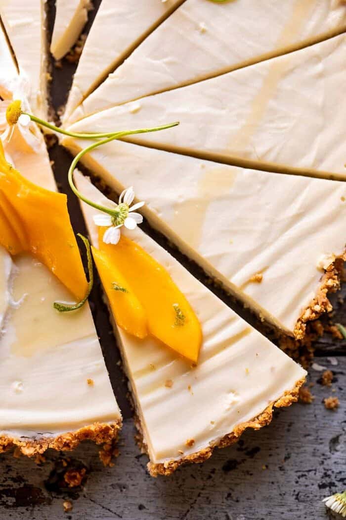 No Fuss Coconut Lime Tart | halfbakedharvest.com overhead close up photo of No Fuss Coconut Lime Tart slice