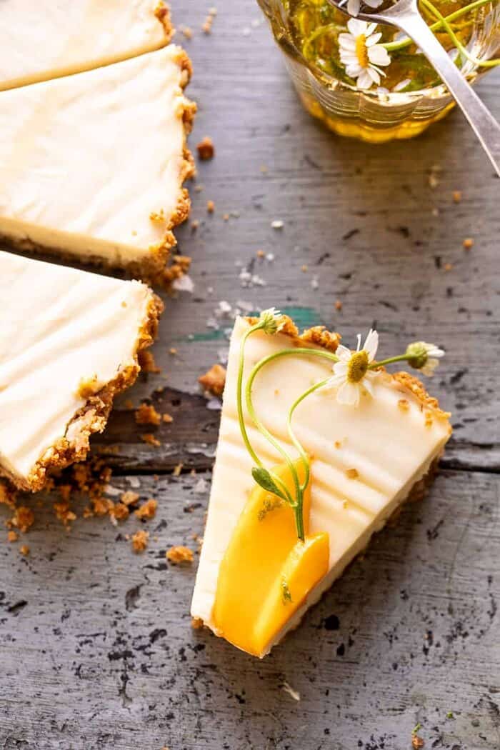 No Fuss Coconut Lime Tart | halfbakedharvest.com overhead close up photo of No Fuss Coconut Lime Tart slice with a bite taken out of the slice