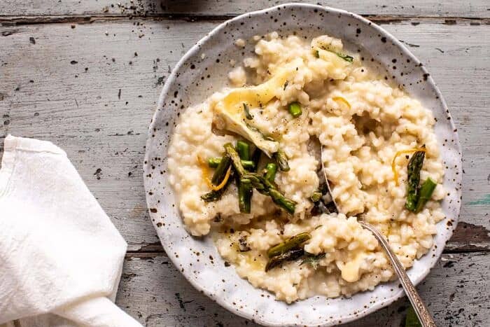 No Stir Brie Risotto with Lemon Butter Asparagus | halfbakedharvest.com overhead horizontal photo of No Stir Brie Risotto with Lemon Butter Asparagus