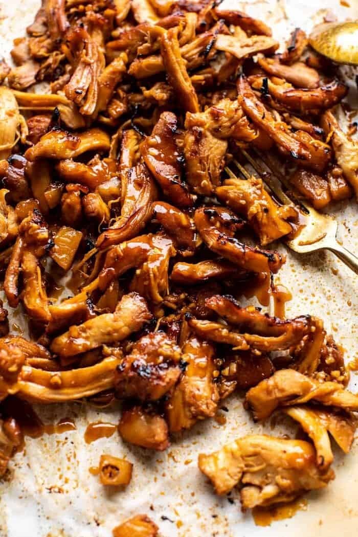 photo of Slow Cooker Braised Hawaiian Pineapple Chicken on baking sheet after broiling 