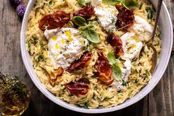 overhead horizontal photo of 20 Minute Orzo Carbonara with Crispy Prosciutto and Burrata 