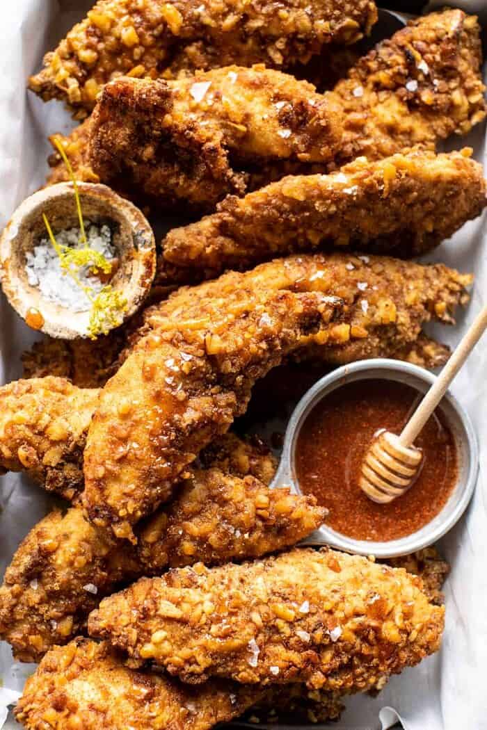 Spicy Honey Mustard Pretzel Chicken Fingers | halfbakedharvest.com overhead close up photo of Spicy Honey Mustard Pretzel Chicken Fingers
