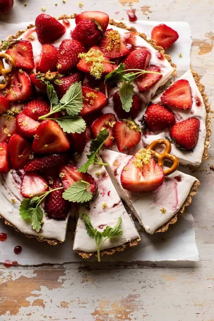 Double Strawberry Pretzel Pie | halfbakedharvest.com overhead photo of Double Strawberry Pretzel Pie with 3 slices cut