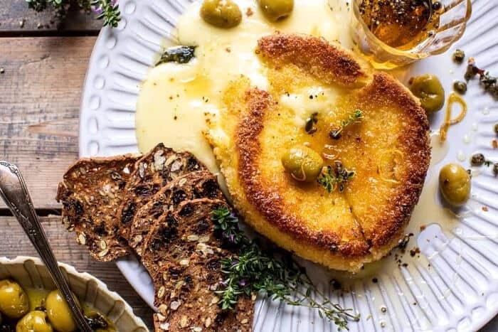 Pan Fried Brie with Peppered Honey and Olives | halfbakedharvest.com overhead photo of Pan Fried Brie with Peppered Honey and Olives