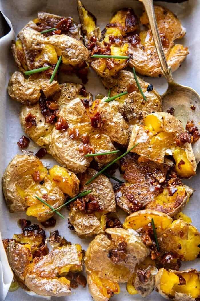 Crispy Smashed Potatoes with Bacon Vinaigrette | halfbakedharvest.com overhead close up photo of Crispy Smashed Potatoes with Bacon Vinaigrette