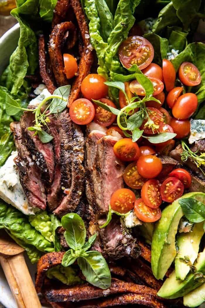 overhead close up photo of Sweet Potato Fry Steak Salad with Blue Cheese Butter 
