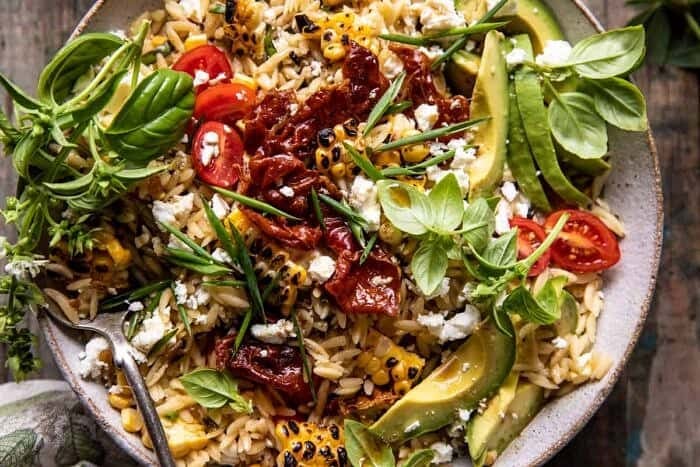 overhead horizontal photo of Brown Butter Corn and Feta Orzo with Crispy Prosciutto