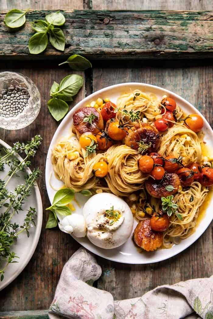 overhead photo of Browned Butter Scallops and Burst Tomato Basil Pasta with burrata 