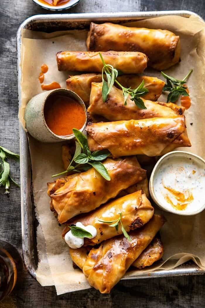 Baked Buffalo Chicken Egg Rolls with Cilantro Lime Ranch | halfbakedharvest.com overhead photo of Baked Buffalo Chicken Egg Rolls with Cilantro Lime Ranch