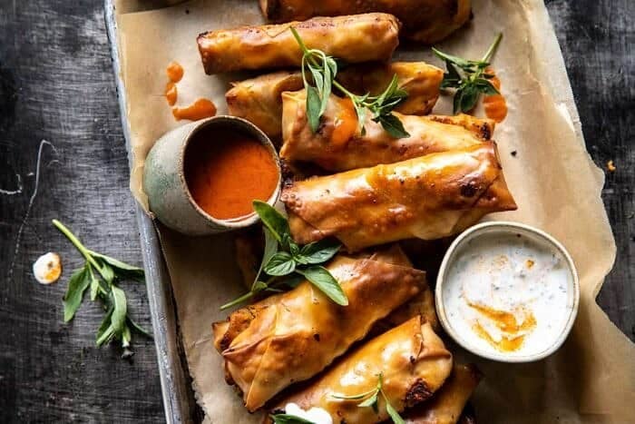 Baked Buffalo Chicken Egg Rolls with Cilantro Lime Ranch | halfbakedharvest.com overhead horizontal photo of Baked Buffalo Chicken Egg Rolls with Cilantro Lime Ranch