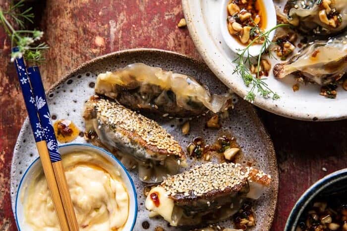overhead horizontal photo of Crispy Sesame Ginger Potstickers with Chive Chili Sauce 