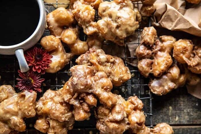 Cinnamon Spiced Apple Fritters with Vanilla Coffee Glaze | halfbakedharvest.com overhead horizontal photo of Cinnamon Spiced Apple Fritters with Vanilla Coffee Glaze