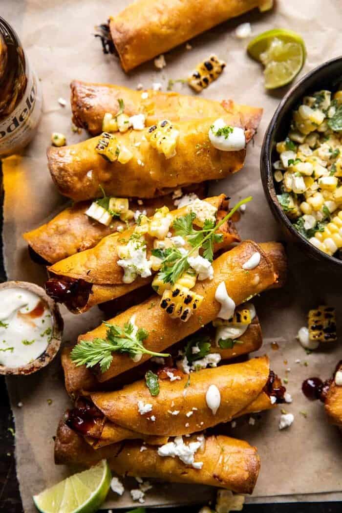 Crockpot BBQ Beer Chicken Taquitos with Street Corn Salsa | halfbakedharvest.com overhead close up photo of Crockpot BBQ Beer Chicken Taquitos with Street Corn Salsa | halfbakedharvest.com