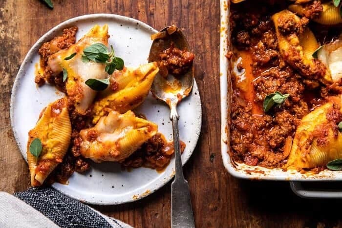 overhead horizontal photo of Pumpkin Cheese Stuffed Pasta Bolognese Bake