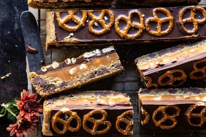 overhead horizontal photo of Salted Pretzel Chocolate Chip Cookie Snickers Bars 
