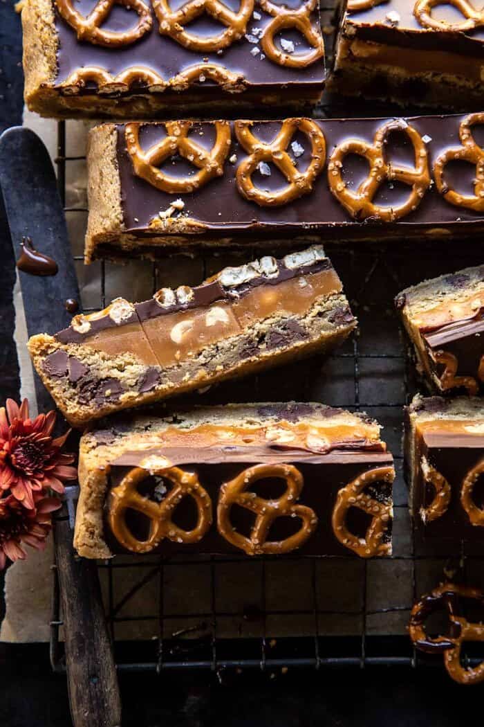 overhead close up photo of Salted Pretzel Chocolate Chip Cookie Snickers Bars 