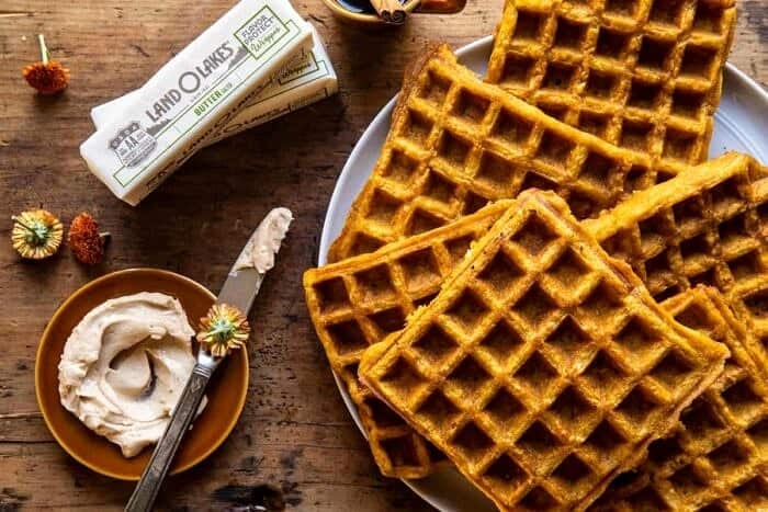 Cider Pumpkin Waffles with Salted Maple Butter | halfbakedharvest.com overhead horizontal photo of the Cider Pumpkin Waffles with Salted Maple Butter before serving