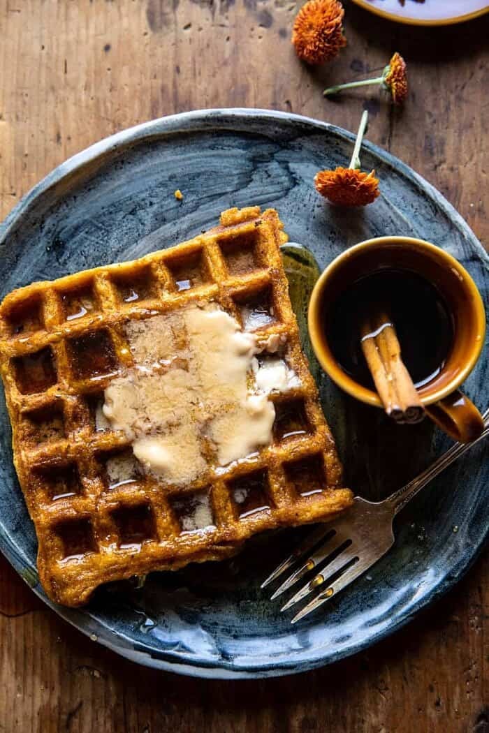 Cider Pumpkin Waffles with Salted Maple Butter | halfbakedharvest.com overhead photo of Cider Pumpkin Waffles with Salted Maple Butter