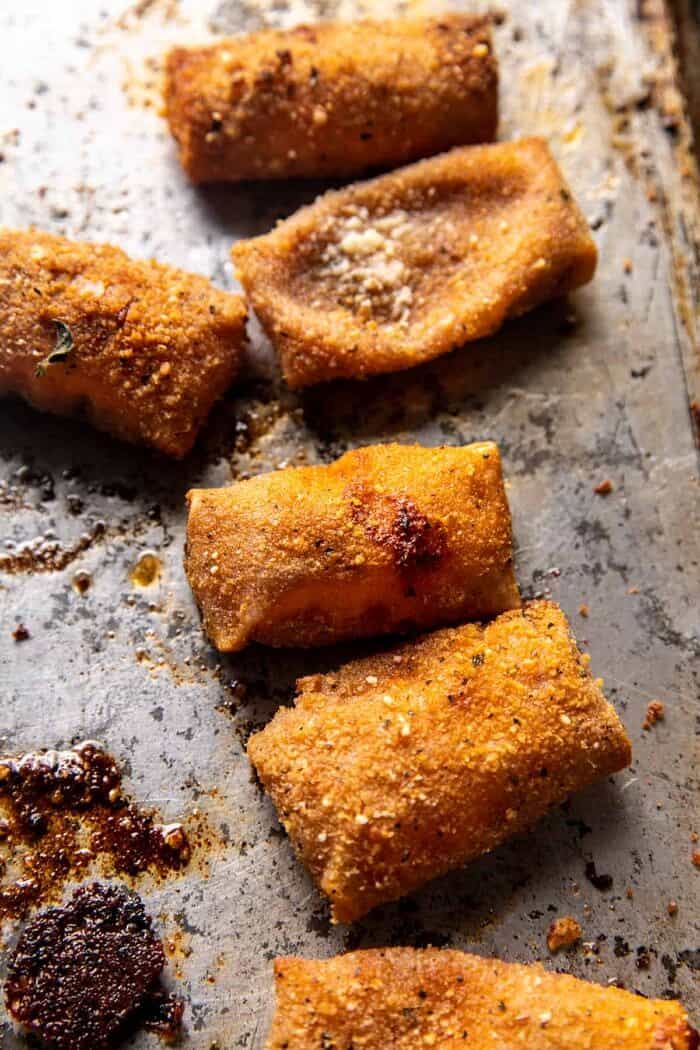Homemade Cheesy Pizza Rolls | halfbakedharvest.com overhead photo of Homemade Cheesy Pizza Rolls on baking sheet after baking